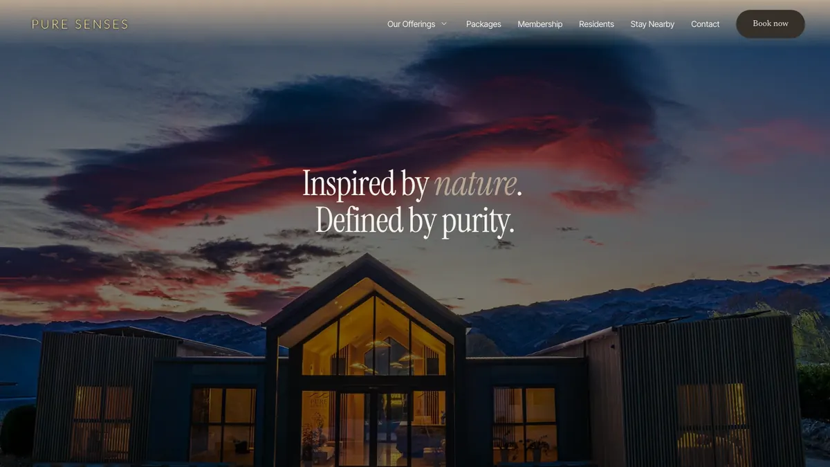 The Pure Senses homepage after the AI session: the spa at dawn under a red sky, with a Book now button