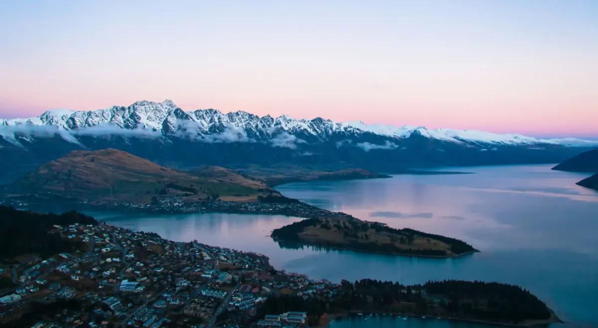 Queenstown and Lake Wakatipu from above, with the Remarkables at dusk