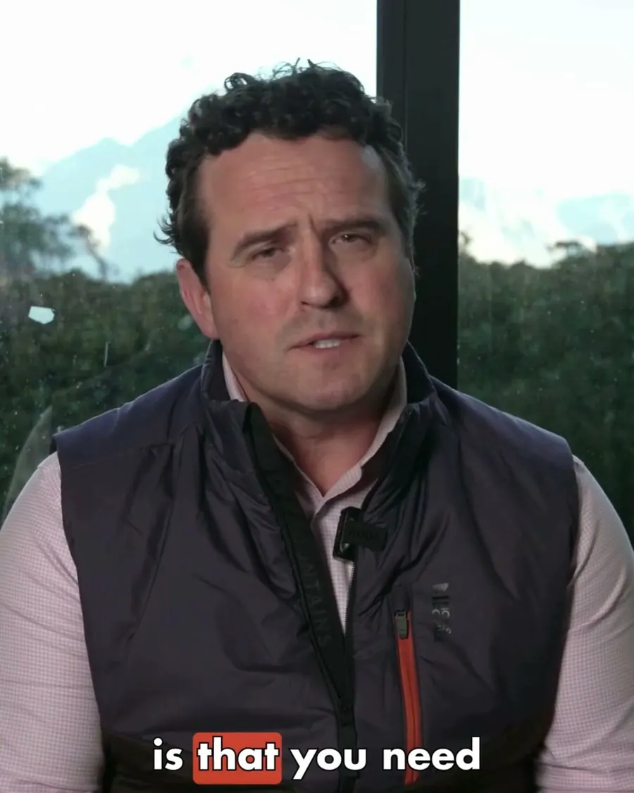 Mortgage adviser Tim Oliver talking to camera in a VegaLend reel, with the mountains behind